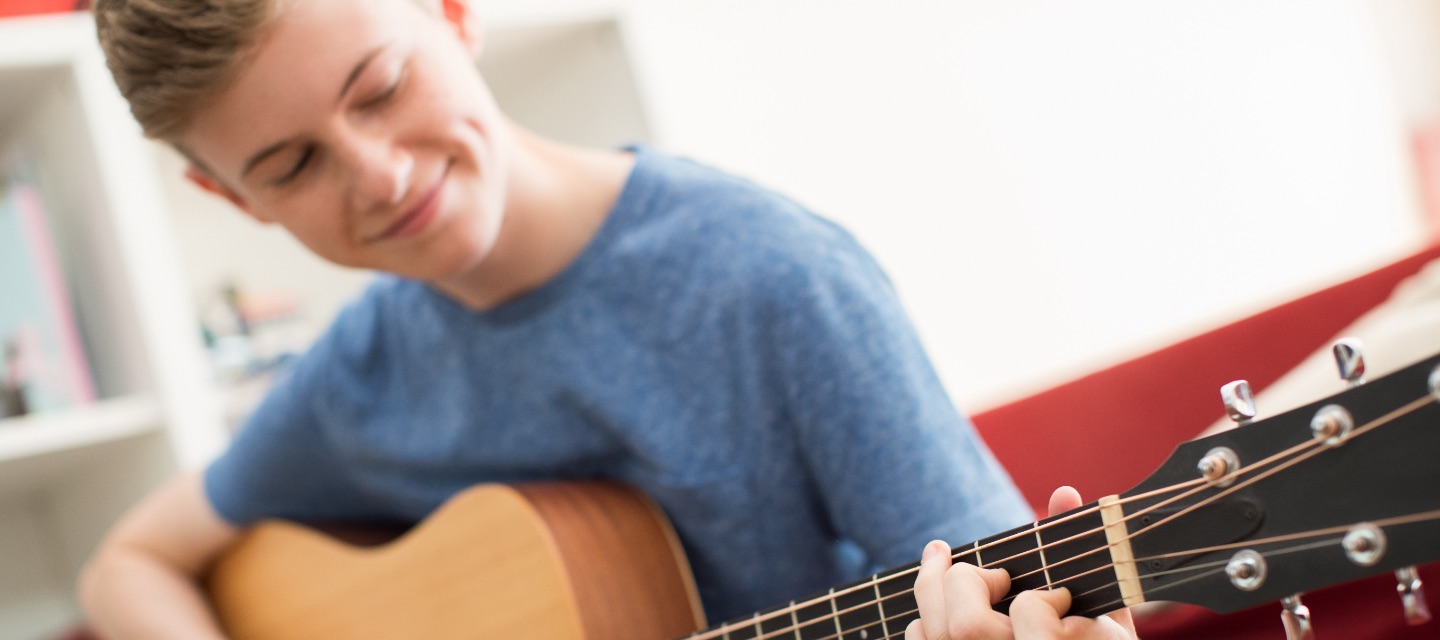 Kid playing guitar